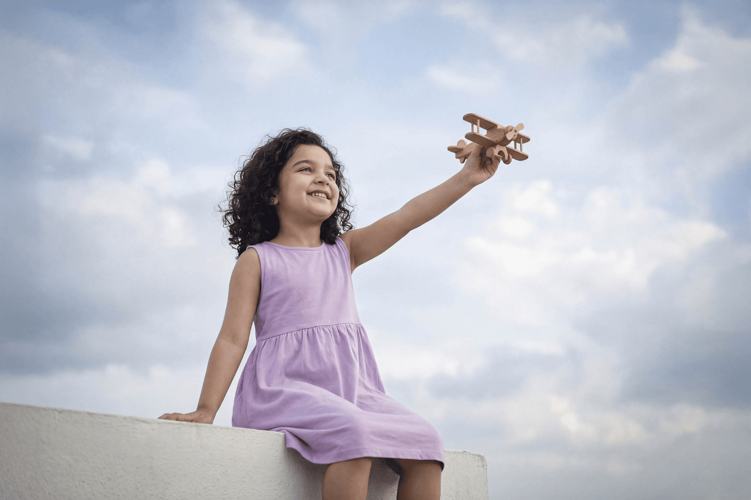 Child with airplane toy