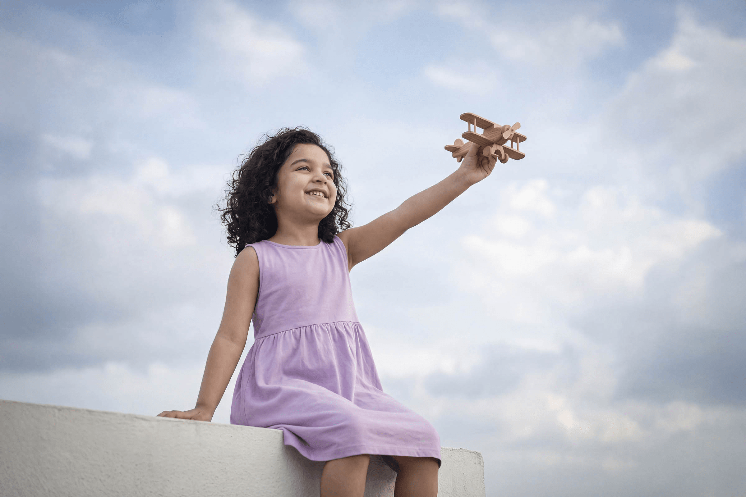 Child with airplane toy